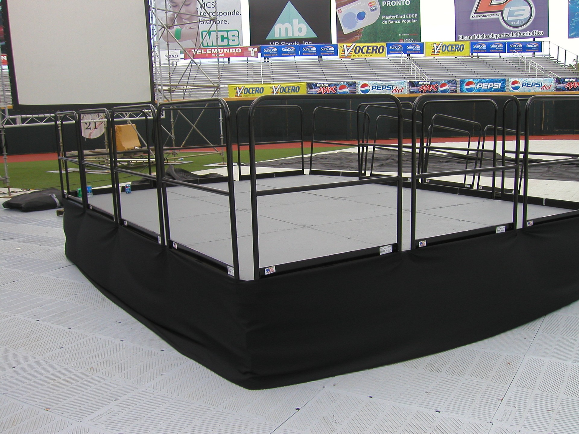 Camera platform with railing at stadium event