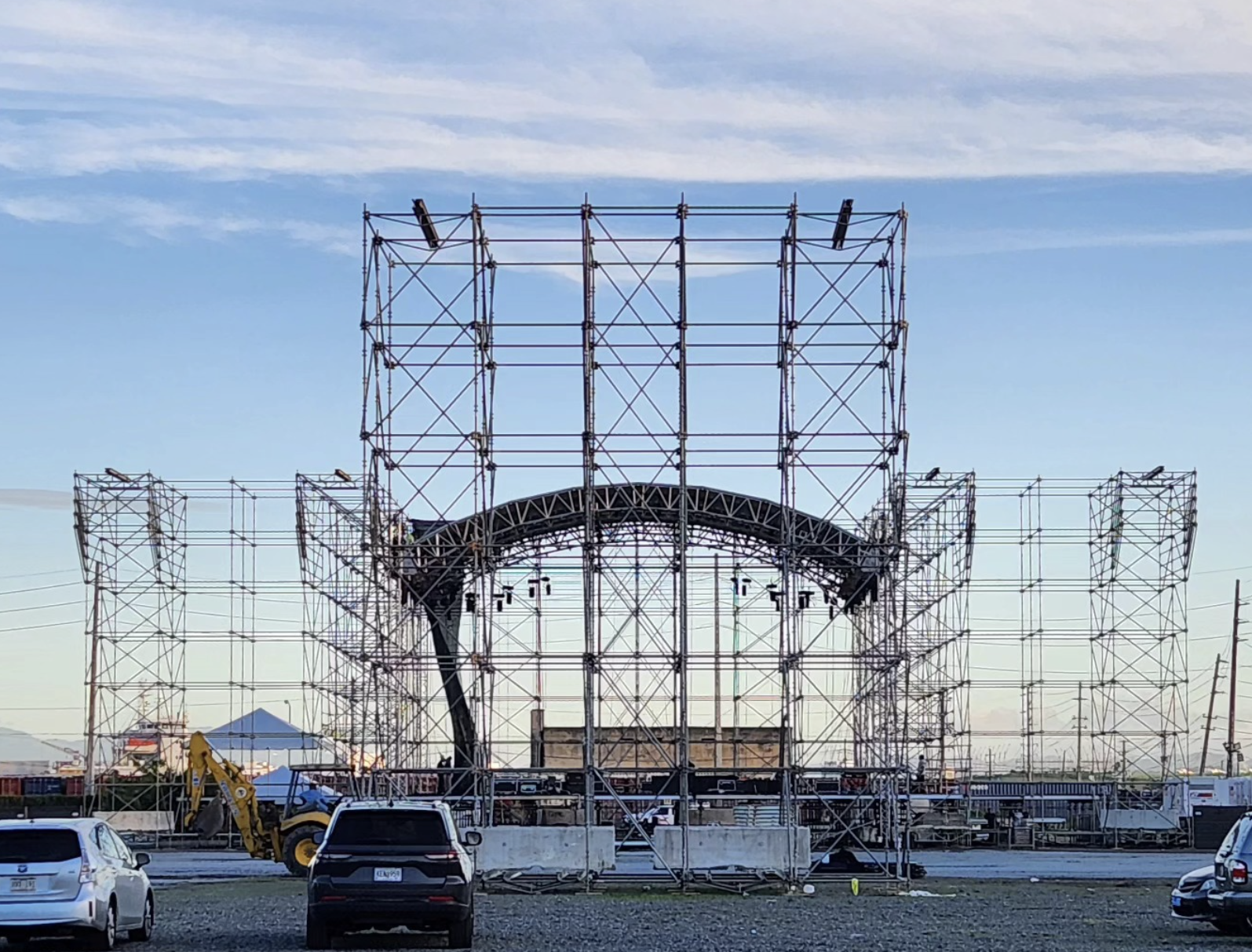 Massive outdoor stage scaffolding with arched roof truss