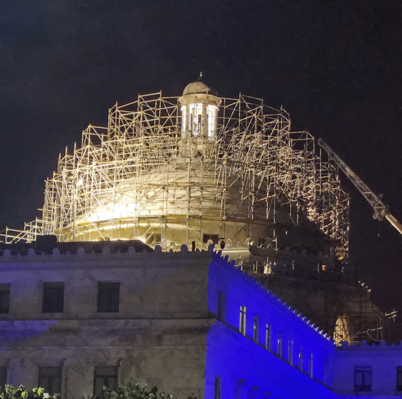 Night view of historic dome restoration scaffolding
