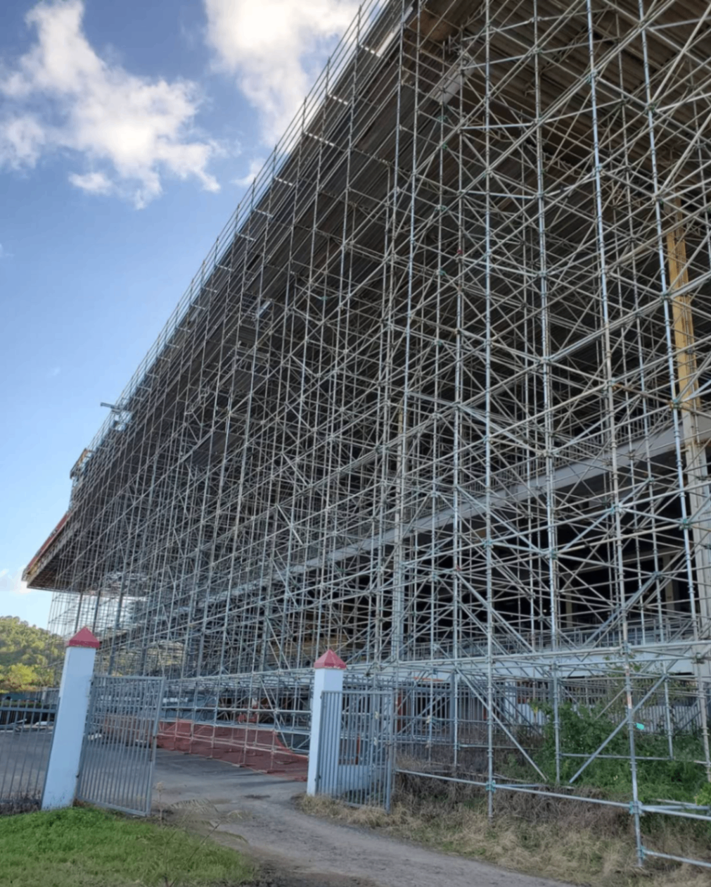 Massive exterior scaffold wall installation at a large venue